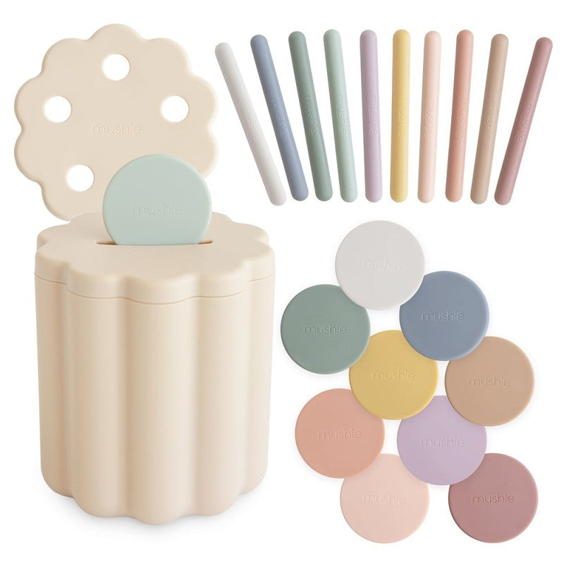 Cubo didáctico tubos/monedas Mushie